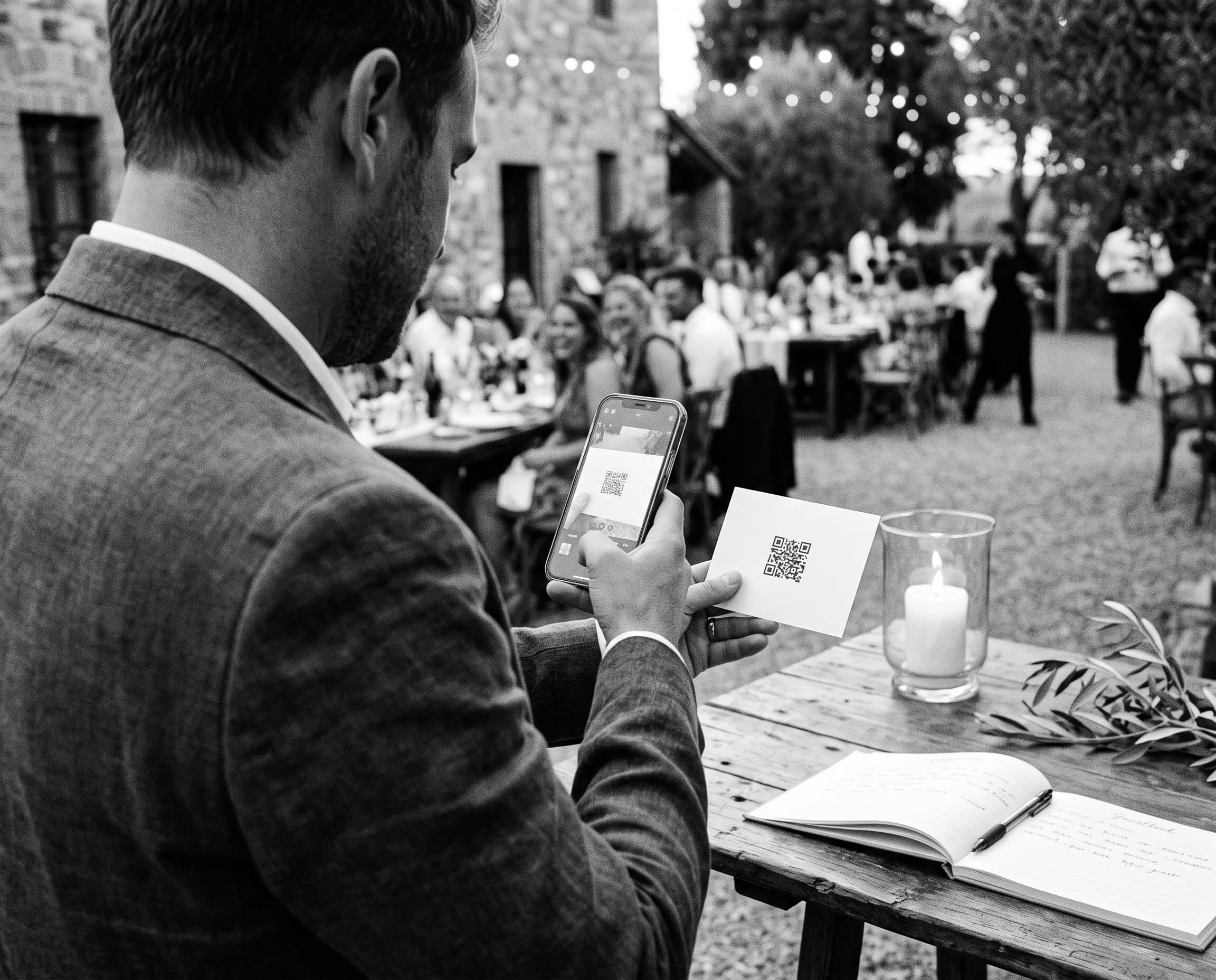 Wedding guest scanning the gallery QR card with a phone